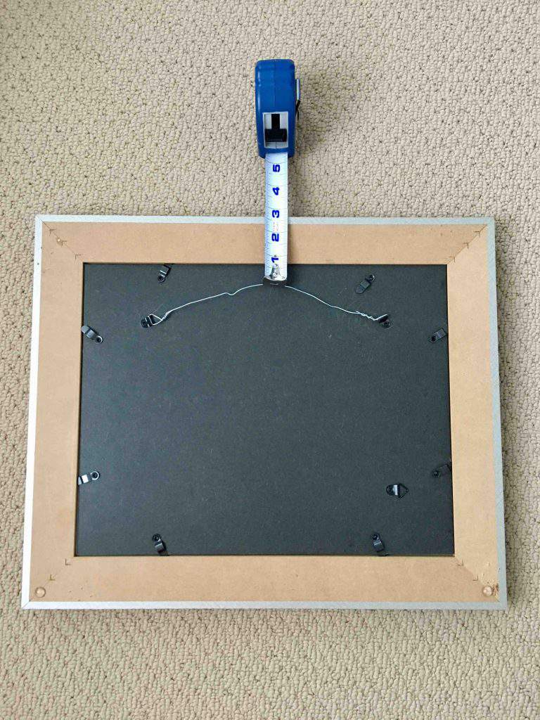 measure the back of a frame for hanger placement