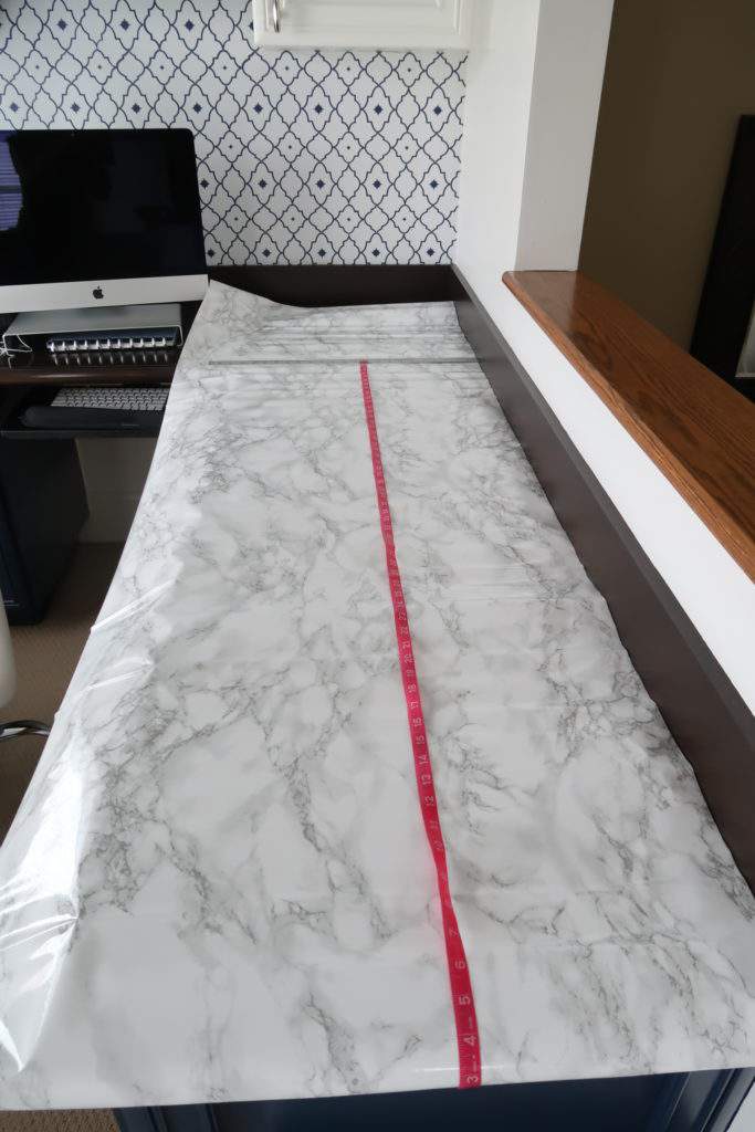 Laying Out Marble Contact Paper on Counter