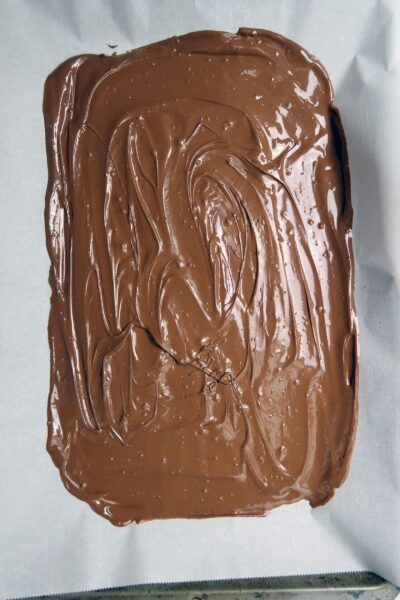 Microwave Peppermint Bark_Melted Milk Chocolate_Spread on Parchment Paper