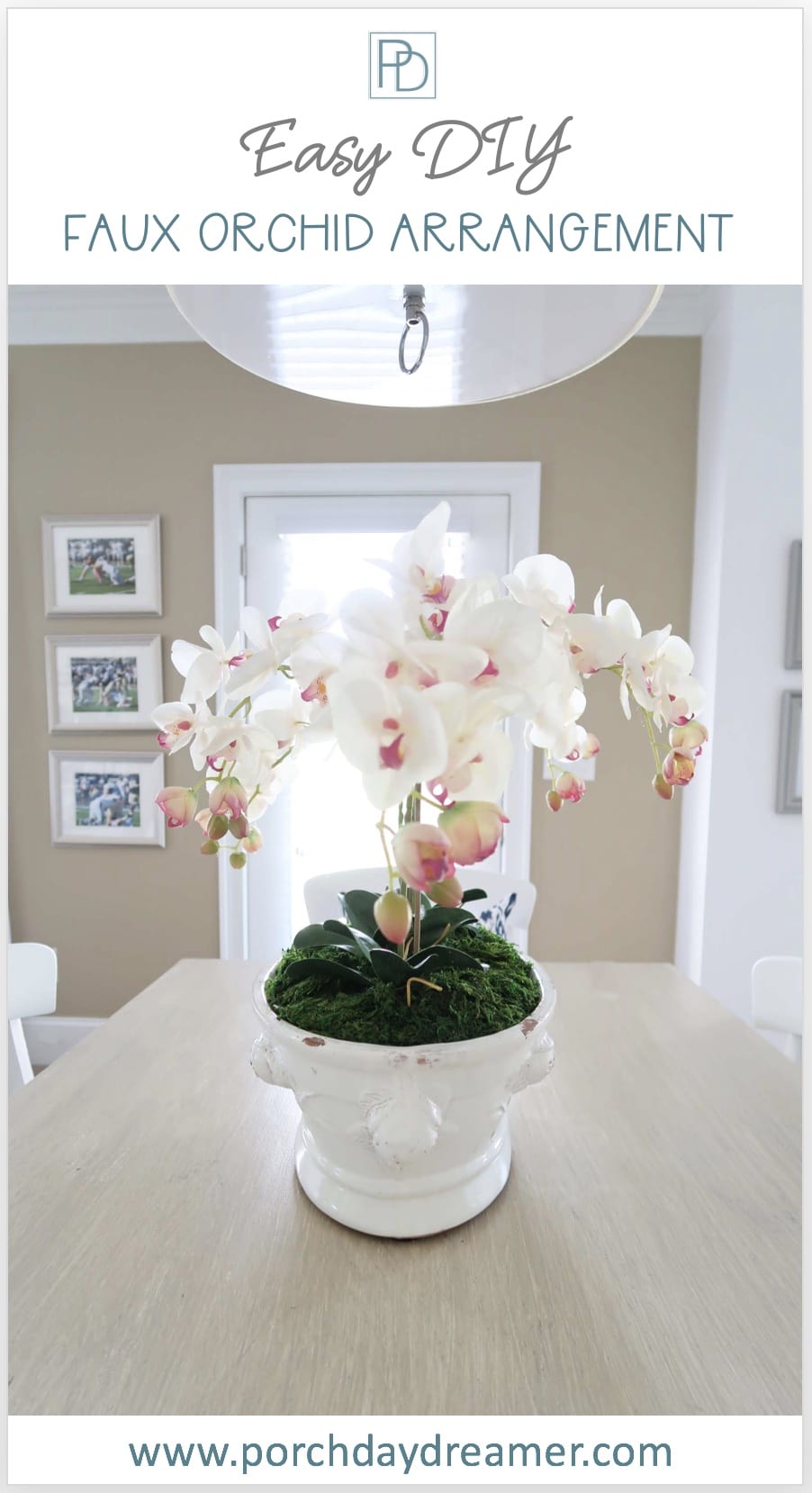 Faux Orchid Arrangement in white cachepot planter