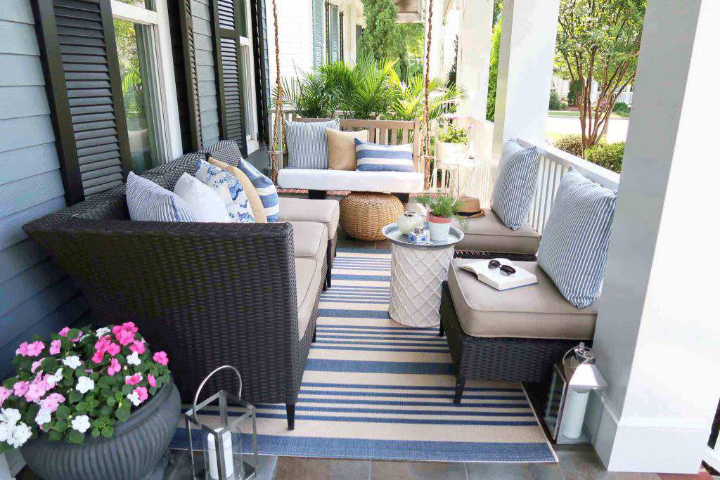 Coastal laid-back front porch mixing sun bleached blues with driftwood finishes and wicker textures