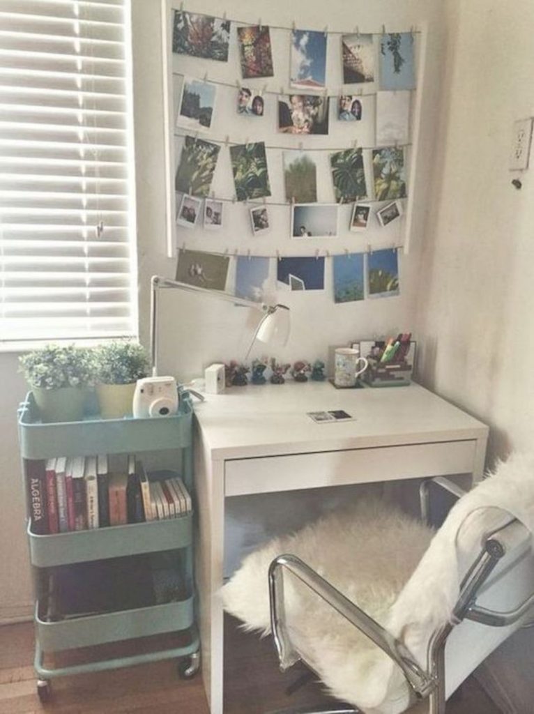 storage cart and small desk with photographs
