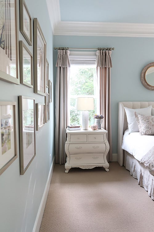 drapery rods painted the same color as picture frames in master bedroom