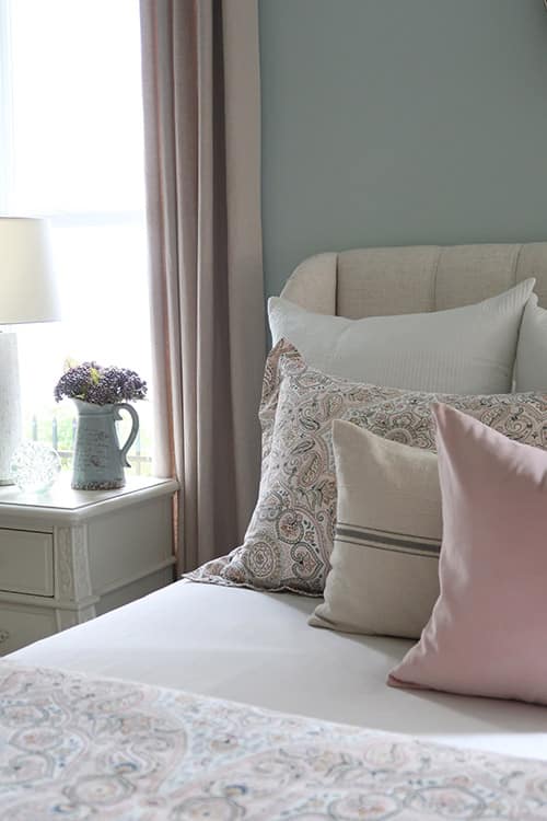 layers of blush pink and grain sack pillows