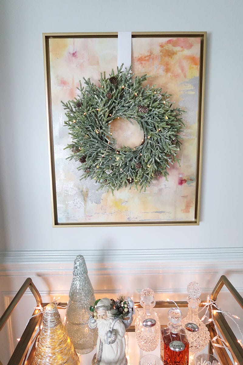 Wreath-Hanging-white-ribbon-over-art