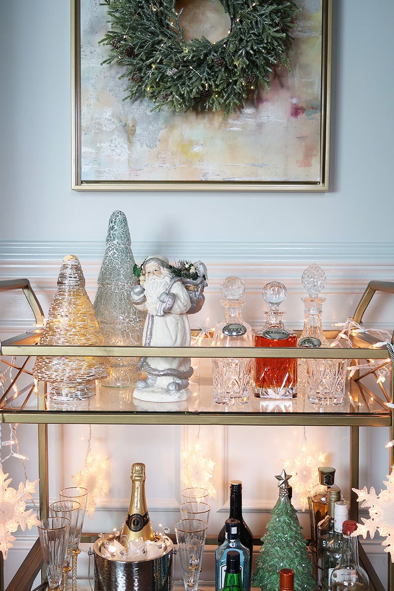 festive-christmas-bar-cart-crystal-decanters-wreath-hanging-above