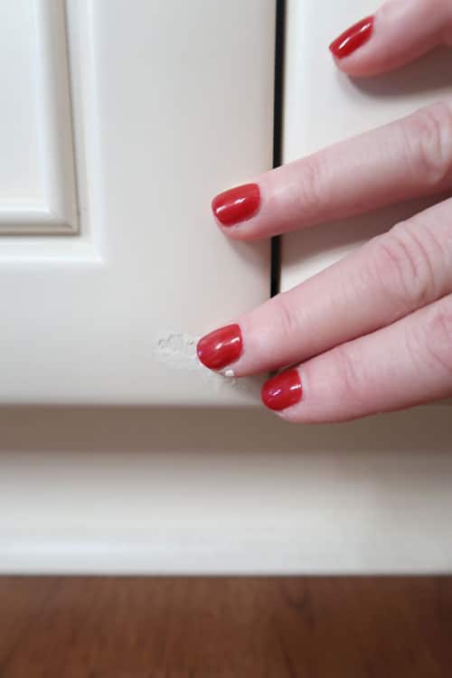 use-fingers-to-remove-excess-paint-from-around-edges-of-repaired-chipped-area