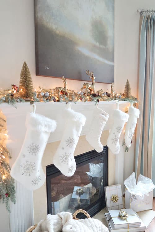 white-stockings-hanging-from-christmas-mantel
