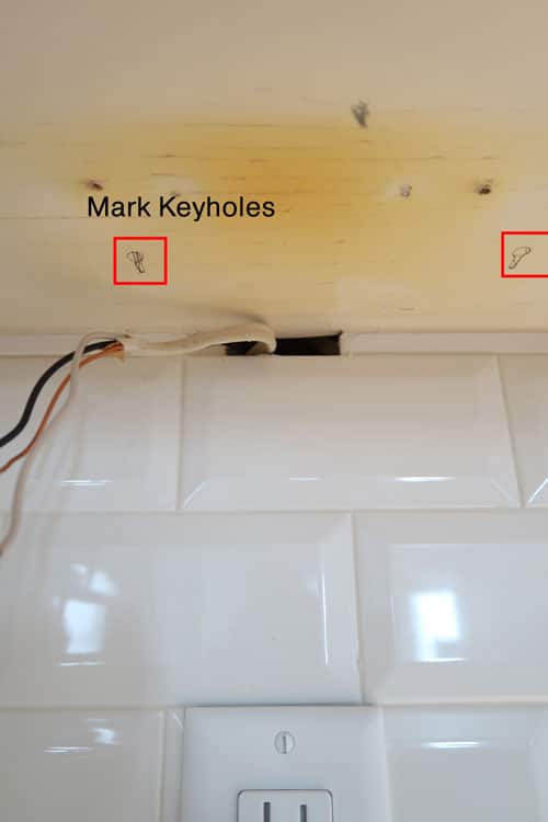 mark-keyholes-under-cabinet