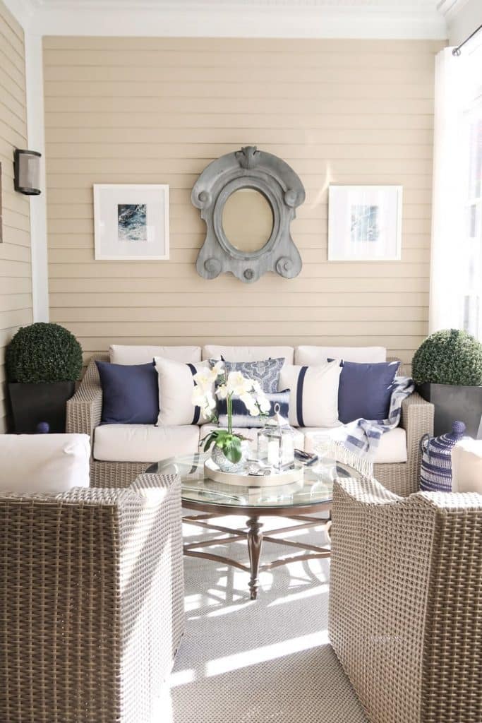 screened-porch-chairs-sofa-driftwood-white-navy-pillows-min