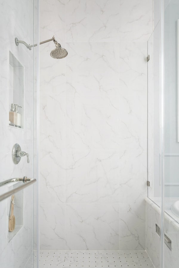 master-bathroom-shower-porcelain-slab-look-for-less-using-large-format-tiles-porch-daydreamer