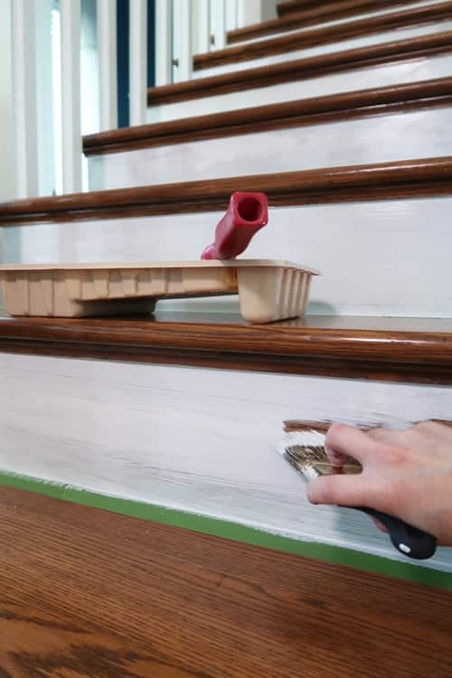 using-a-brush-prime-and-paint-edges-of-stair-risers