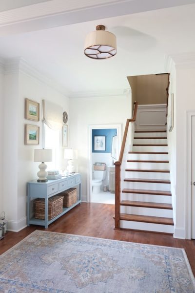 vintage rug-view-from-the-dining-room-looking-at-newly-painted-staircase