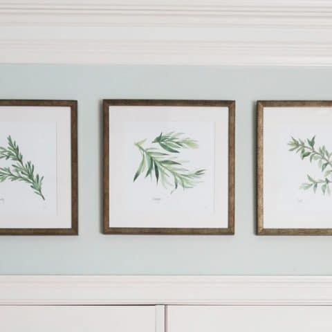 set-of-three-herb-print-artwork-hanging-evenly-in-a-row