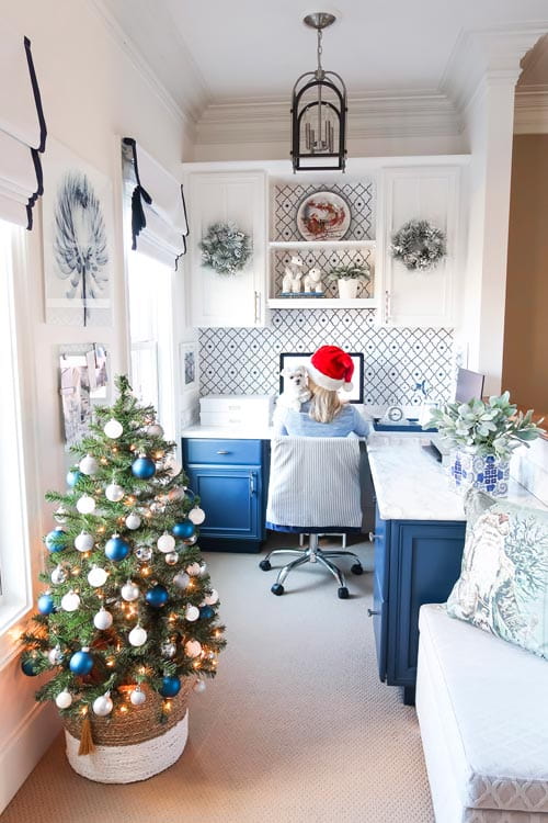 office-christmas-blue-white-woman-santa-hat-white-dog
