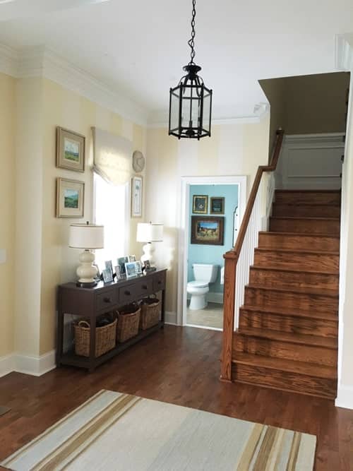 foyer-in-dark-colors-before-painting-stairs-and-console-table