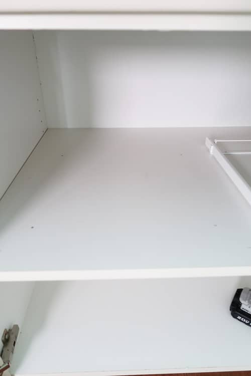 mark-frame-hole-locations-on-cabinet-shelf-for-pull-out-drawer-placement