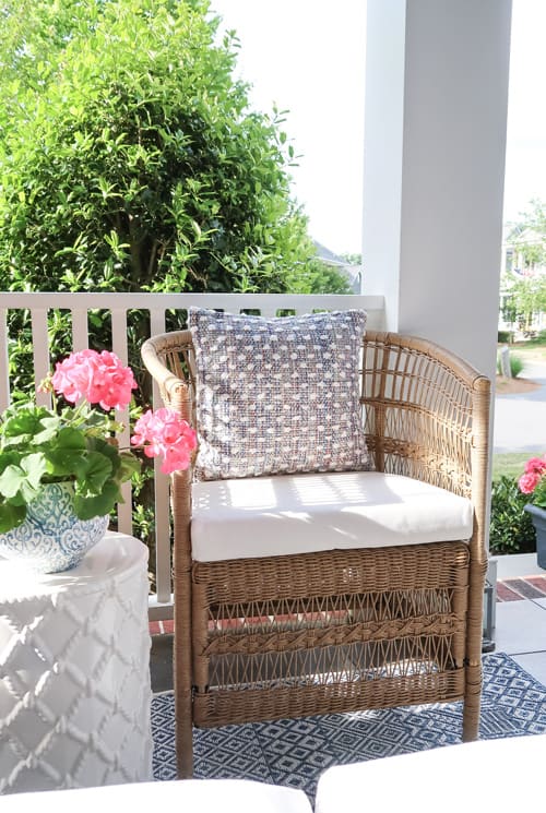 Woven-Barrel-Outdoor-Woven-Chair-Textured-Pillow-Pink-Flowers-Porch