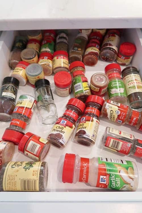Unorganized-spice-bottles-in-drawer