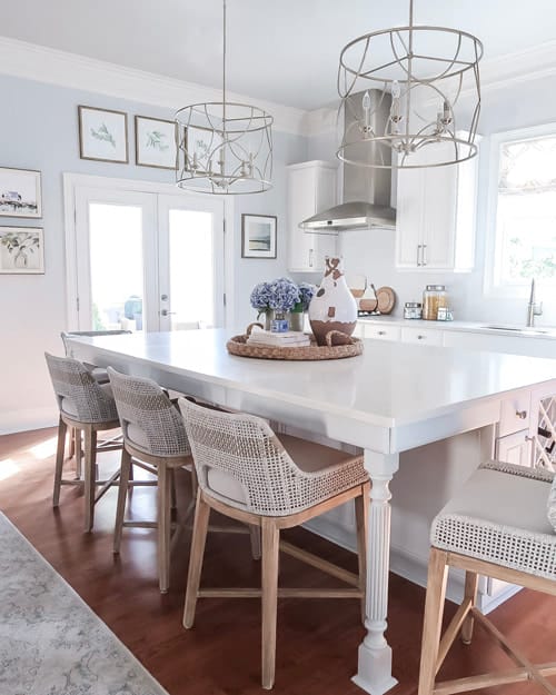 white-blue-kitchen-remodel-woven-counter-stools-large-quartz-island