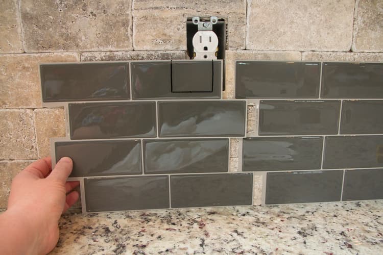 eel-stick-tiles-over-existing-tile-backsplash