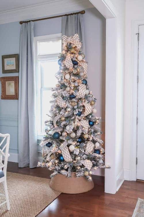 flocked-christmas-tree-gold-blue-white-ribbon