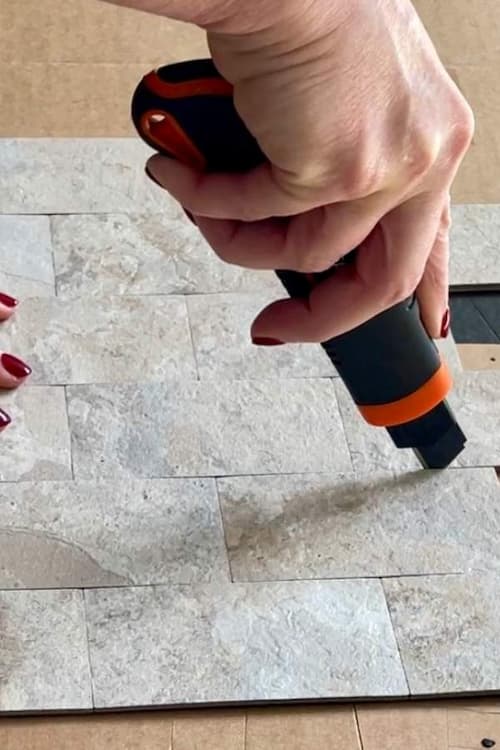 cut-stick-on-tile-utility-knife-between-pieces