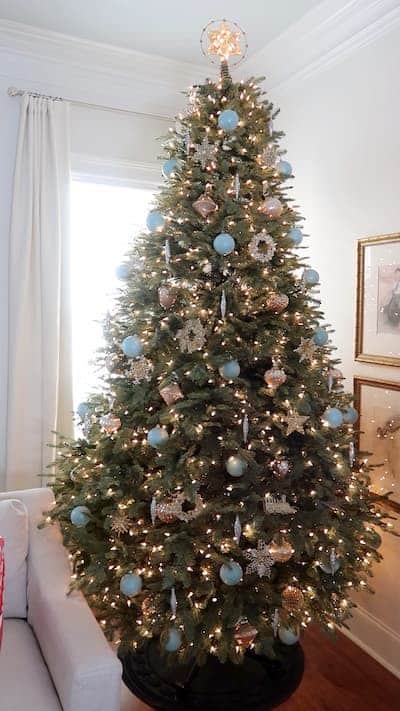 placing-glitter-ornaments-christmas-tree