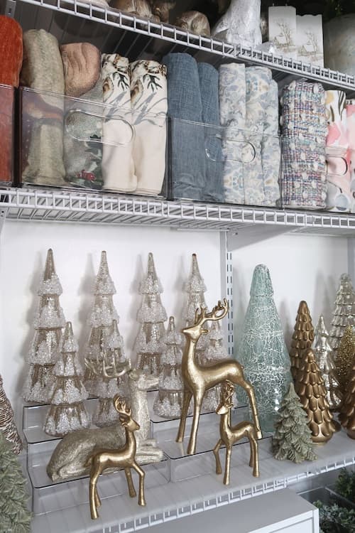 pillows-rolled-organized-by-color-christmas-trees-reindeer-stored-risers