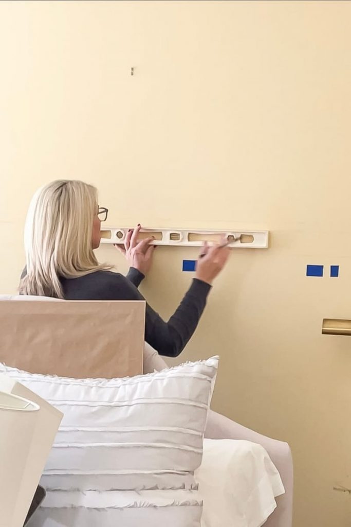 woman-level-draw-board-batten-wall-plan-tape-vertical-batten-pattern
