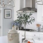 open-pendant-light-island-brighten-dark-kitchen-white-cabinets-blue-walls