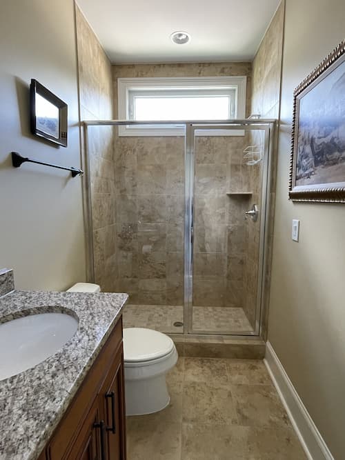 beige-tile-bathroom-shower-before-painting-tiles