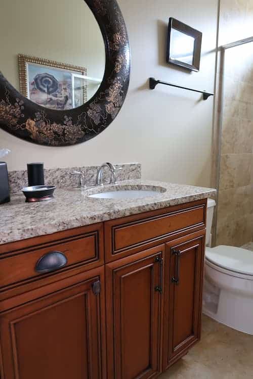stained-wood-bathroom-vanity-granite-counter-before-painting