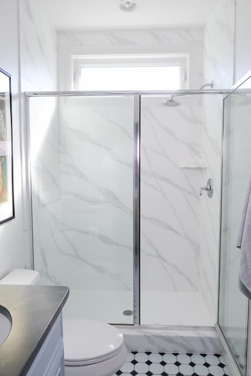 shower-tile-painted-look-like-cararra-marble-slab