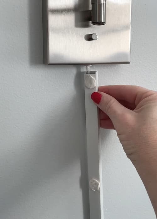 attach-back-plate-mounting-putty-to-wall