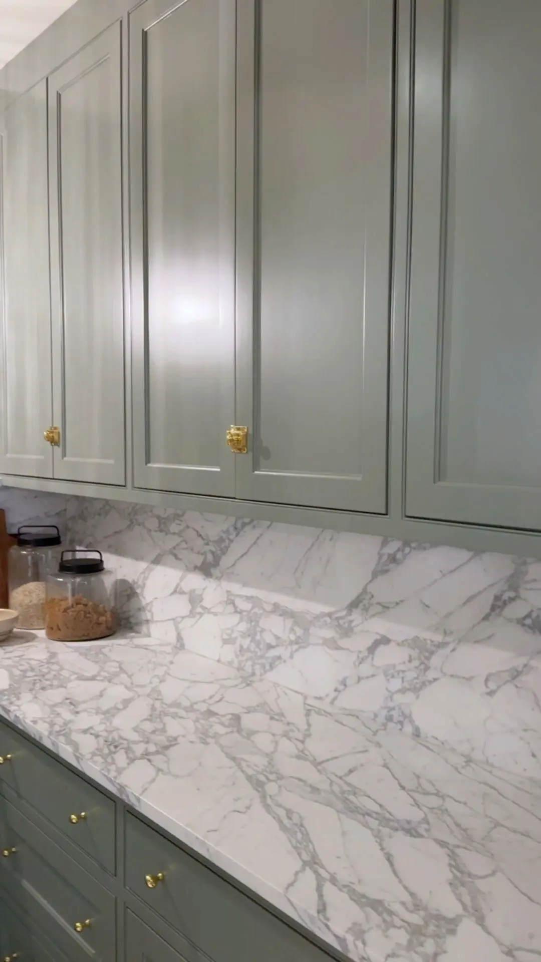 sage-green-kitchen-cabinets-marble-counter-backsplash-gold-cabinet-hardware